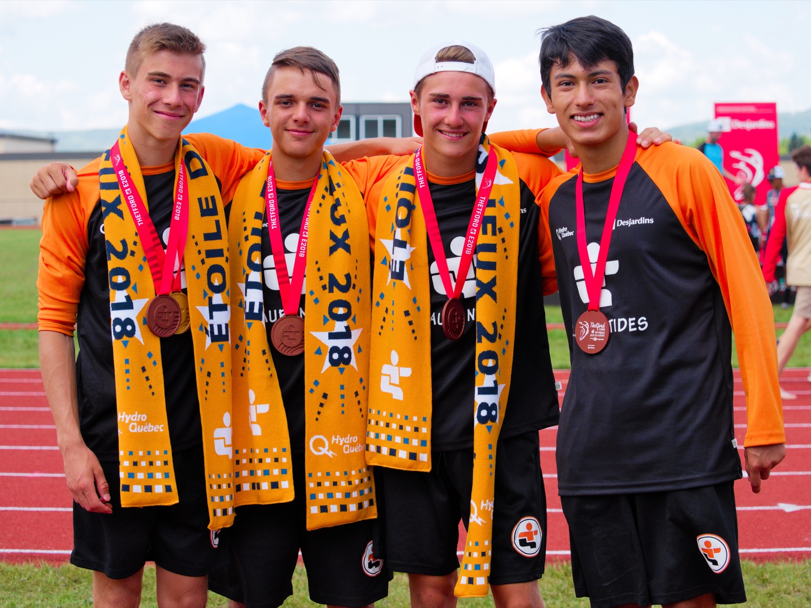 Le 4x100 mètres masculin. De gauche à droite : Samuel Musto, Maxim Bélisle, William Blanchet-Martineau et Carl Picard (Photo : Louis-Olivier Brassard)